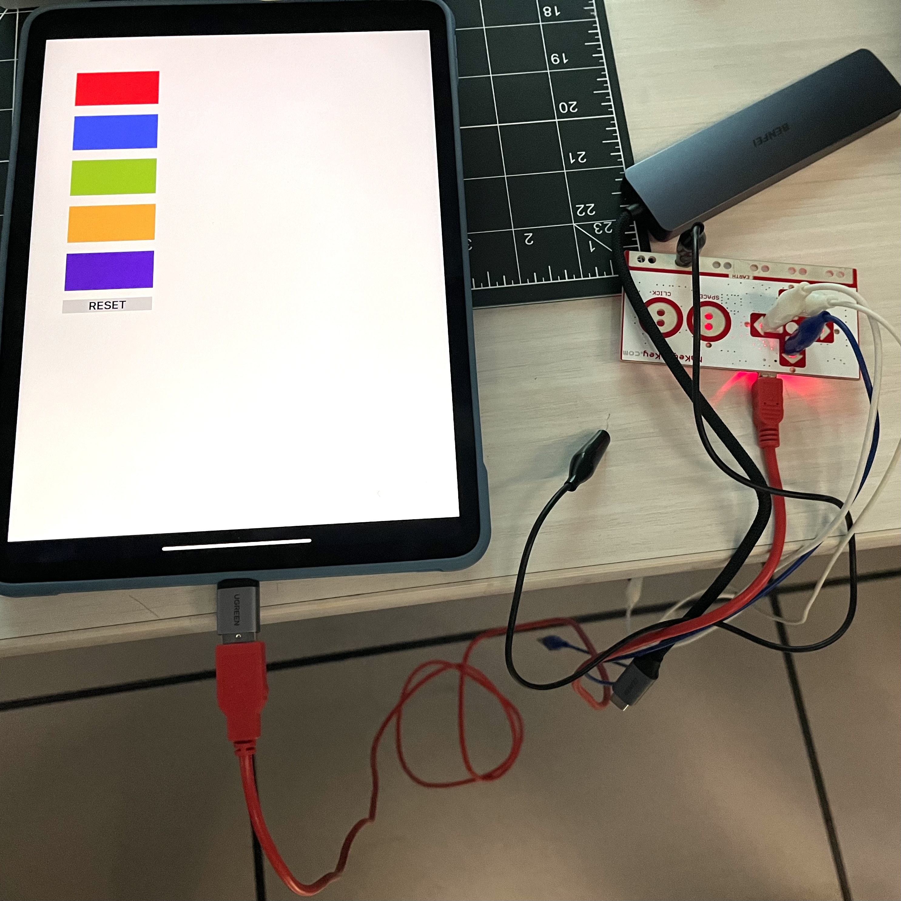 A physical interaction with the Makey Makey that produces a digital colour output by corresponding to certain key presses