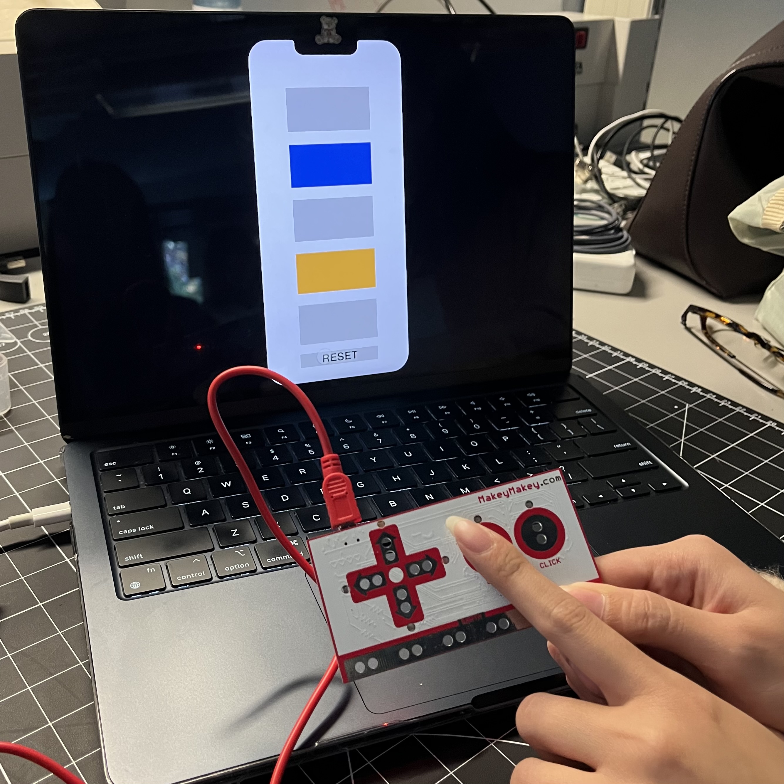 A physical interaction with the Makey Makey that produces a digital colour output by corresponding to certain key presses
