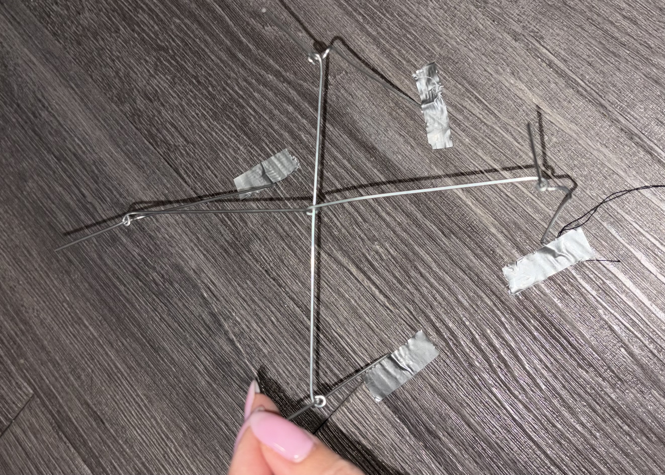 testing a base structure made from stem wire and round nose pliers to bend the wire