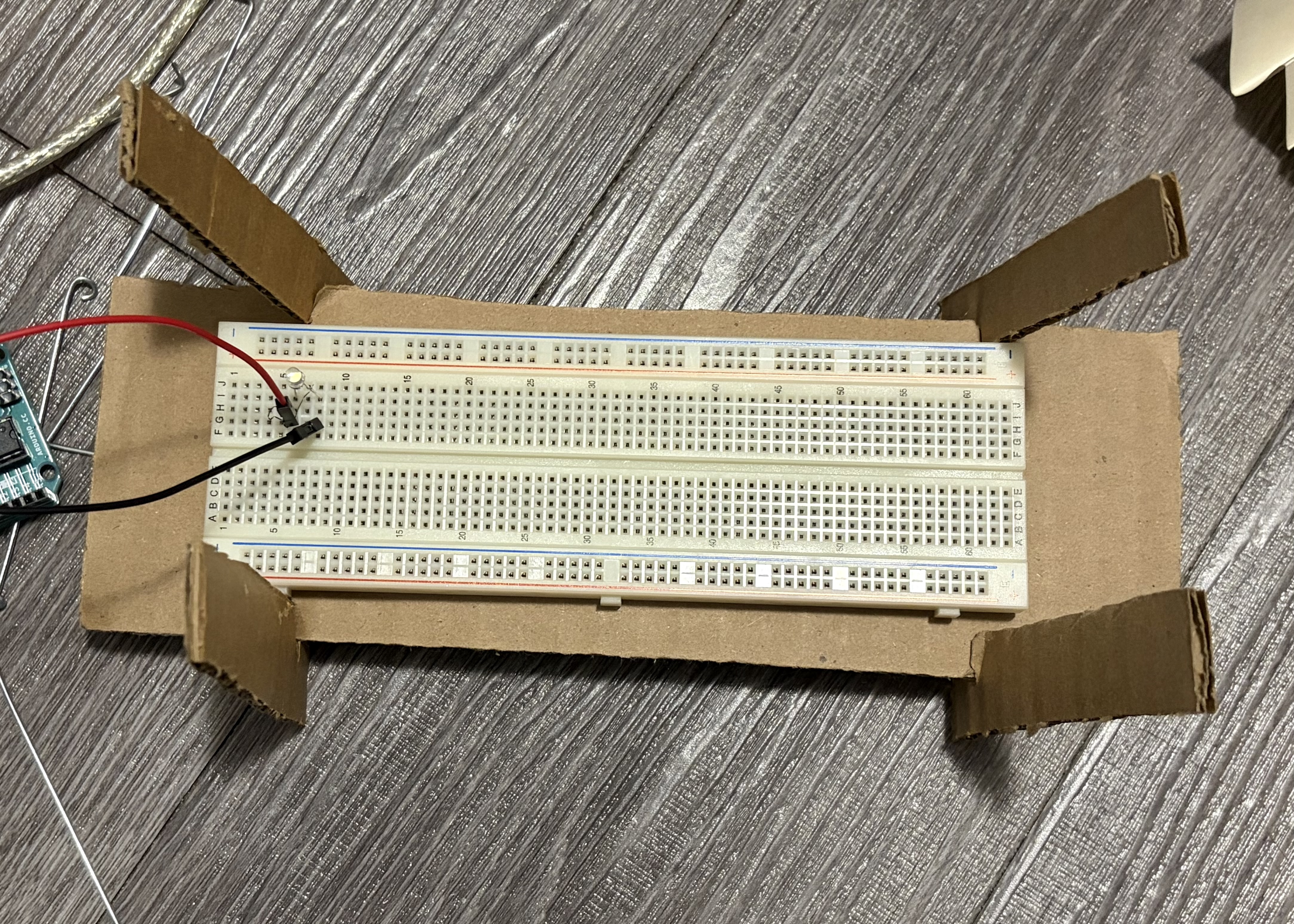 Cardboard base made by creating slits into all pieces so they can slide into eachother